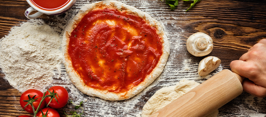 Homemade pizza dough with sauce